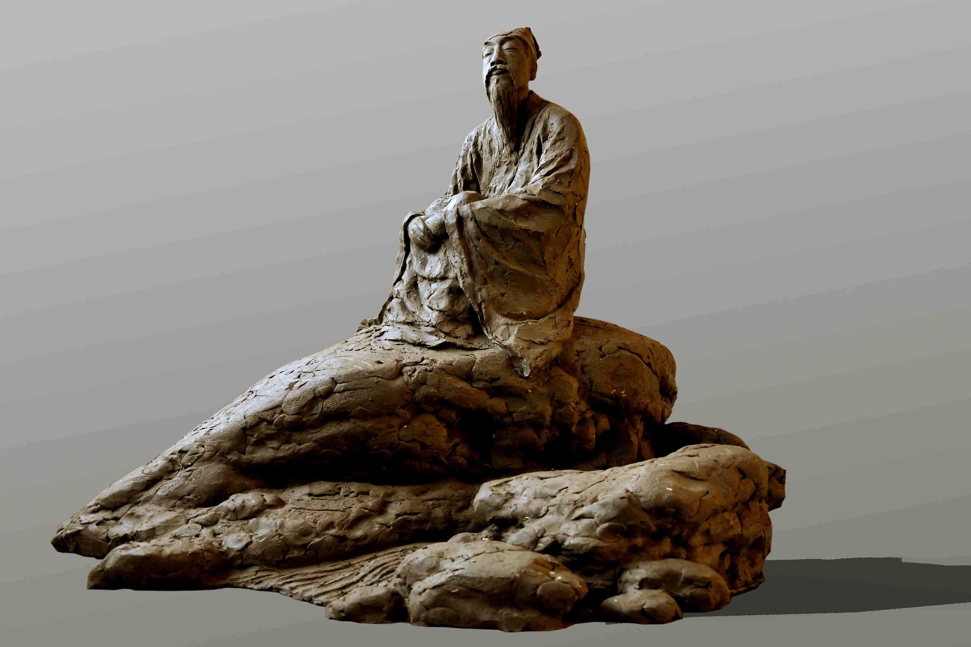 苏辙坐在石头上听泉的古代雕塑